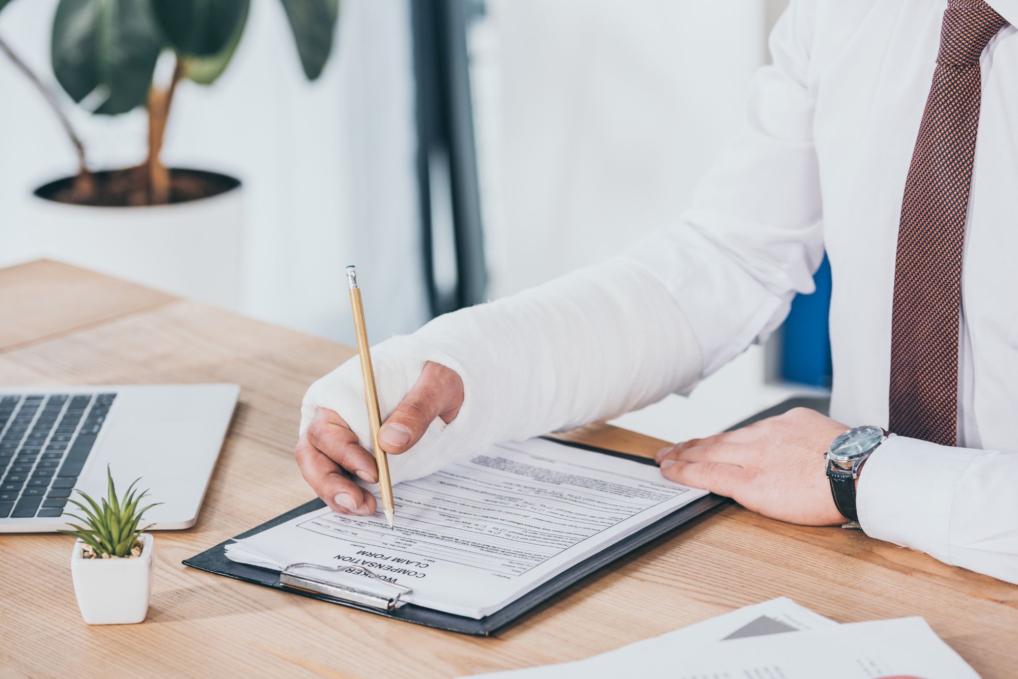 A doctor sits at a desk, learning how to improve his patient intake process.